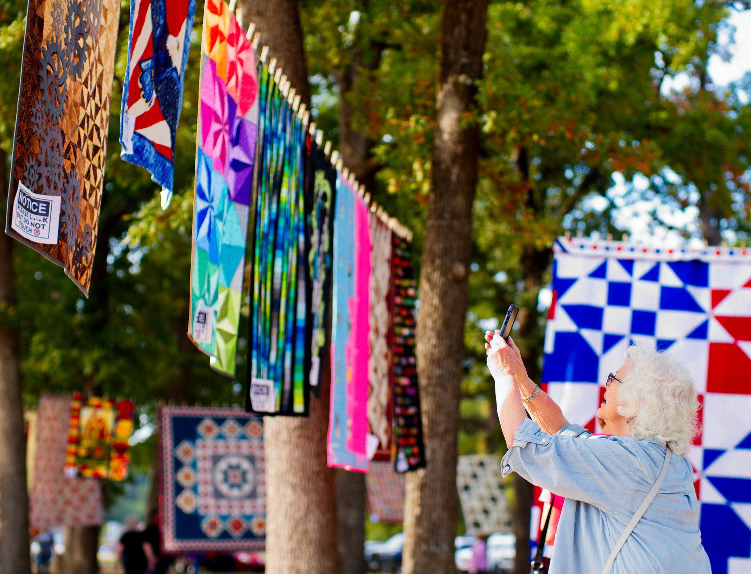 Stephanie Hauson snaps photos of her favorite stitches during Quilts in the Park.
